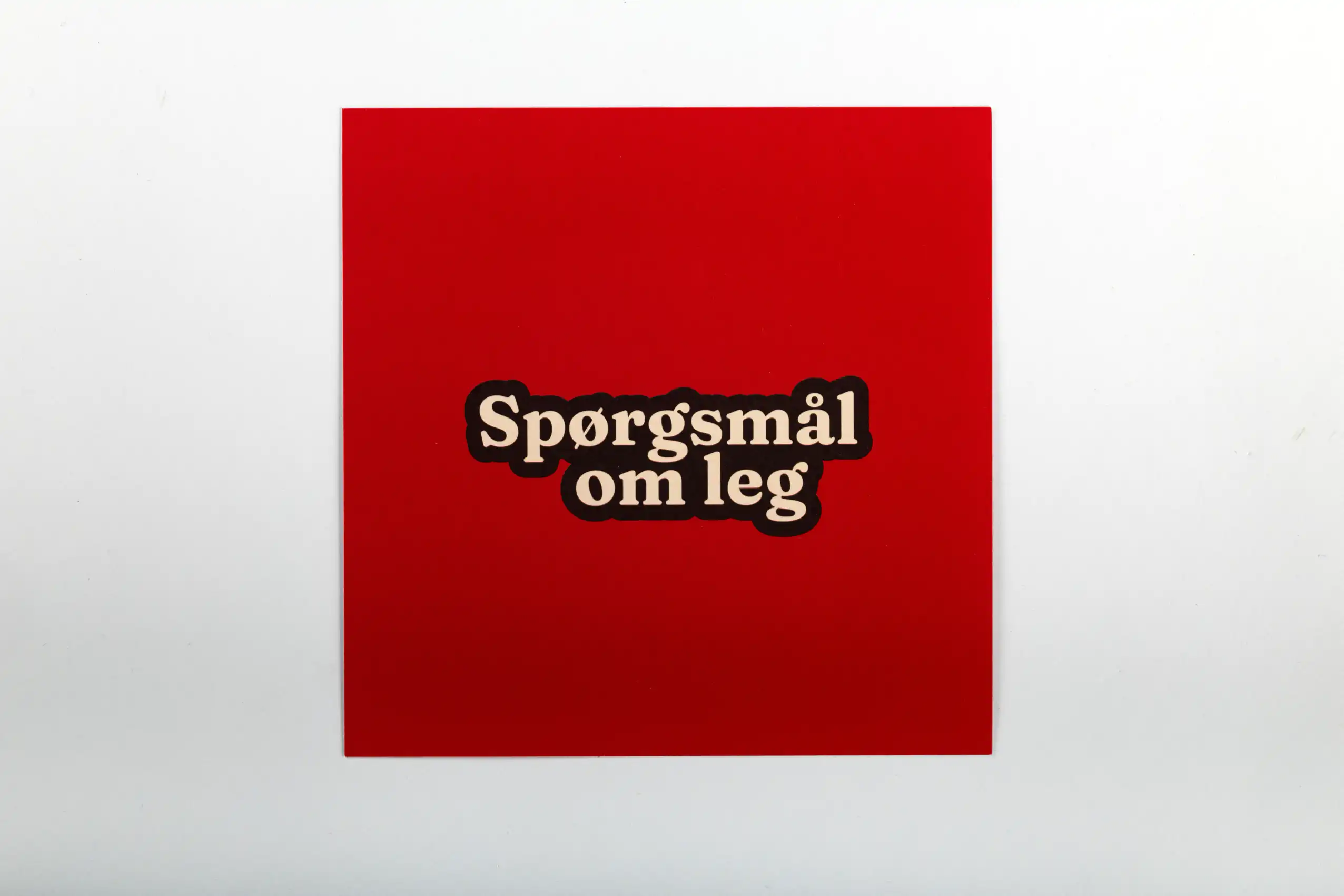 Bagsiden til kortene spørgsmål om leg.